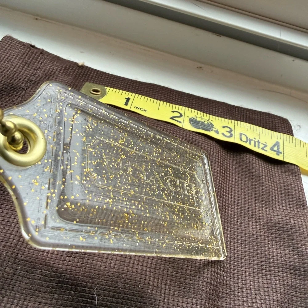 Coach Poopy Clear and gold‎ Glitter Hang Tag
